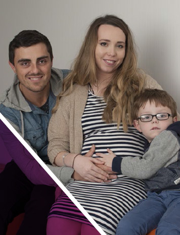 Phot of a family: Man, Pregnant Woman and a young boy.