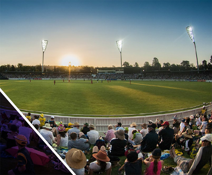 Crowd at a sportsground under lights